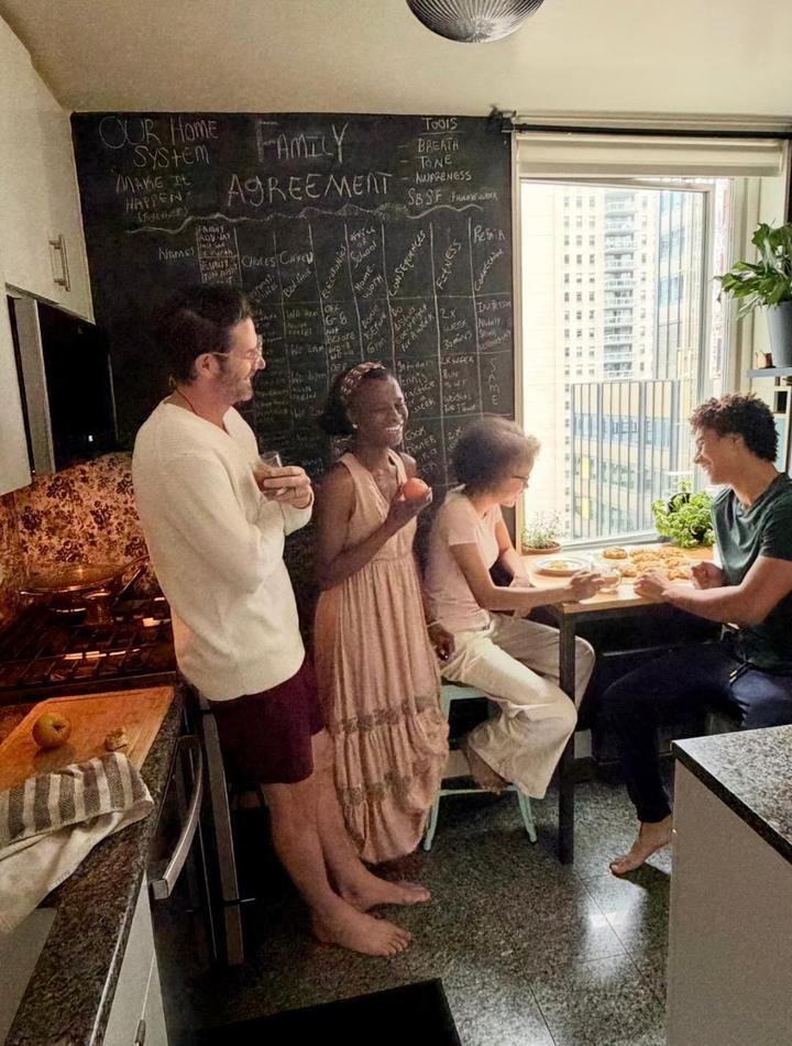 A family at their agreement board