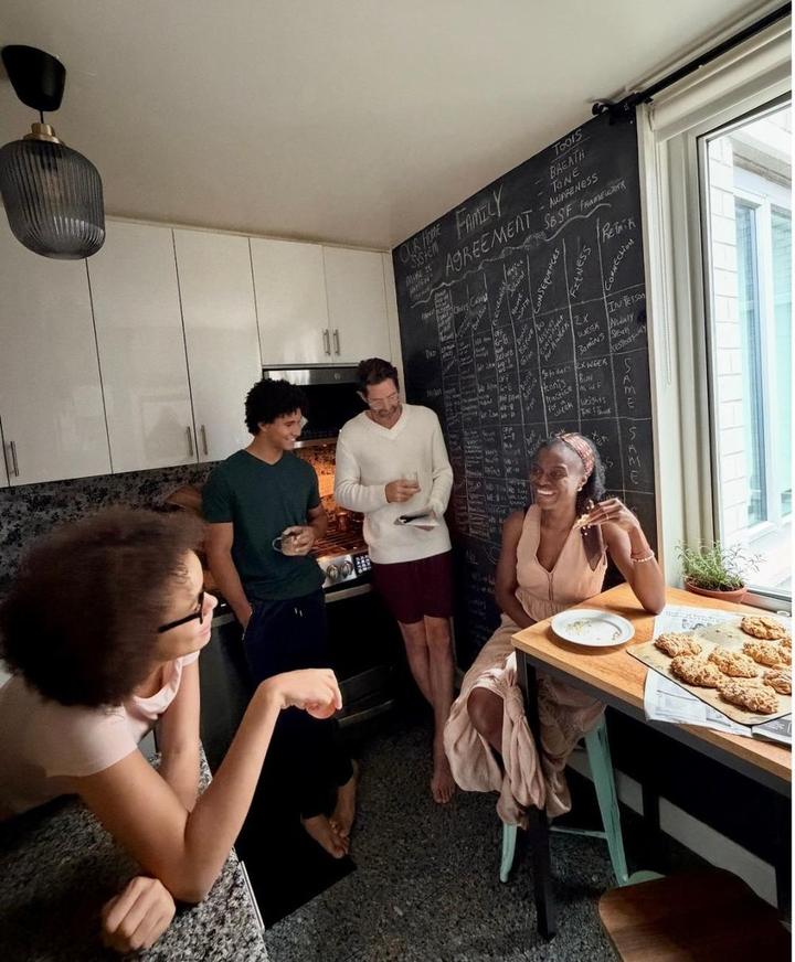 A family talking at the kitchen table