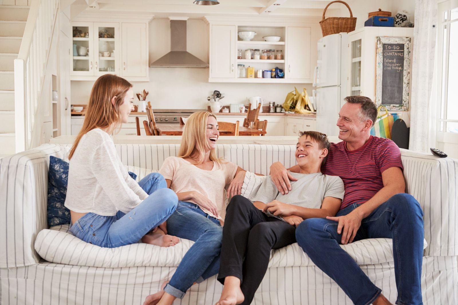 A family together at home, laughing