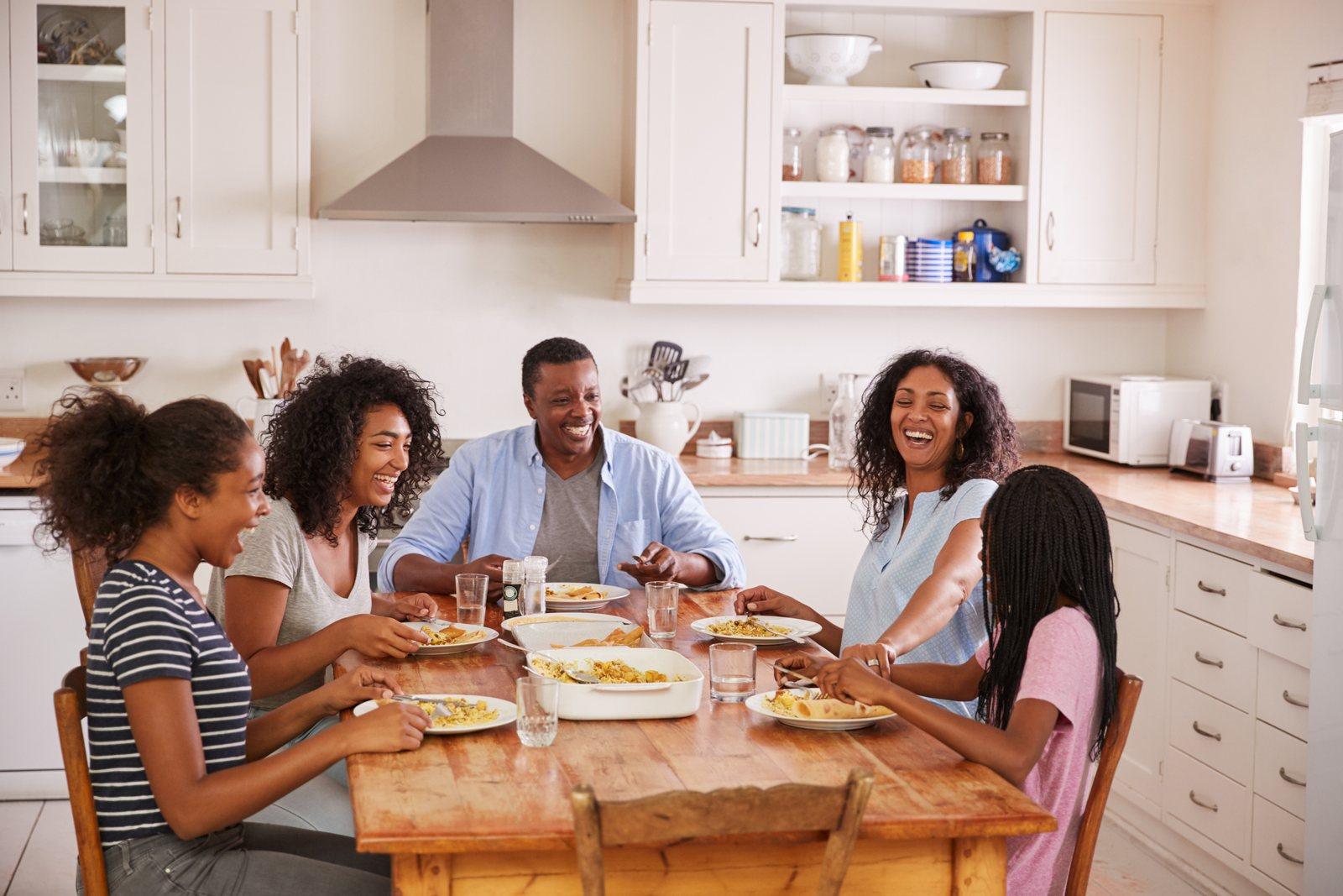 A family together at home, laughing